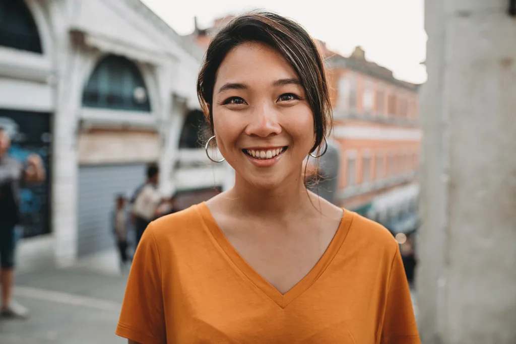 Portrait of a young adult Asian woman with a smiling face